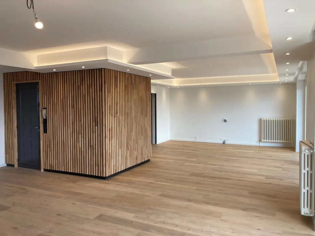 Reunion-2-appartements_rodez-intramuros_architecte3 Le salon du nouvel appartement formé par les deux anciens